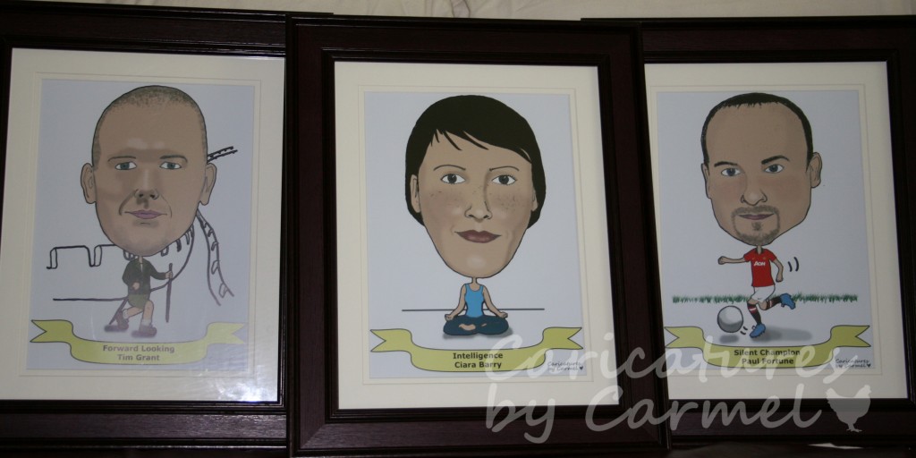 Close up of three of the framed caricatures