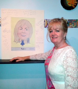 Anita with her Caricature Guest Signing board on her 50th Birthday party